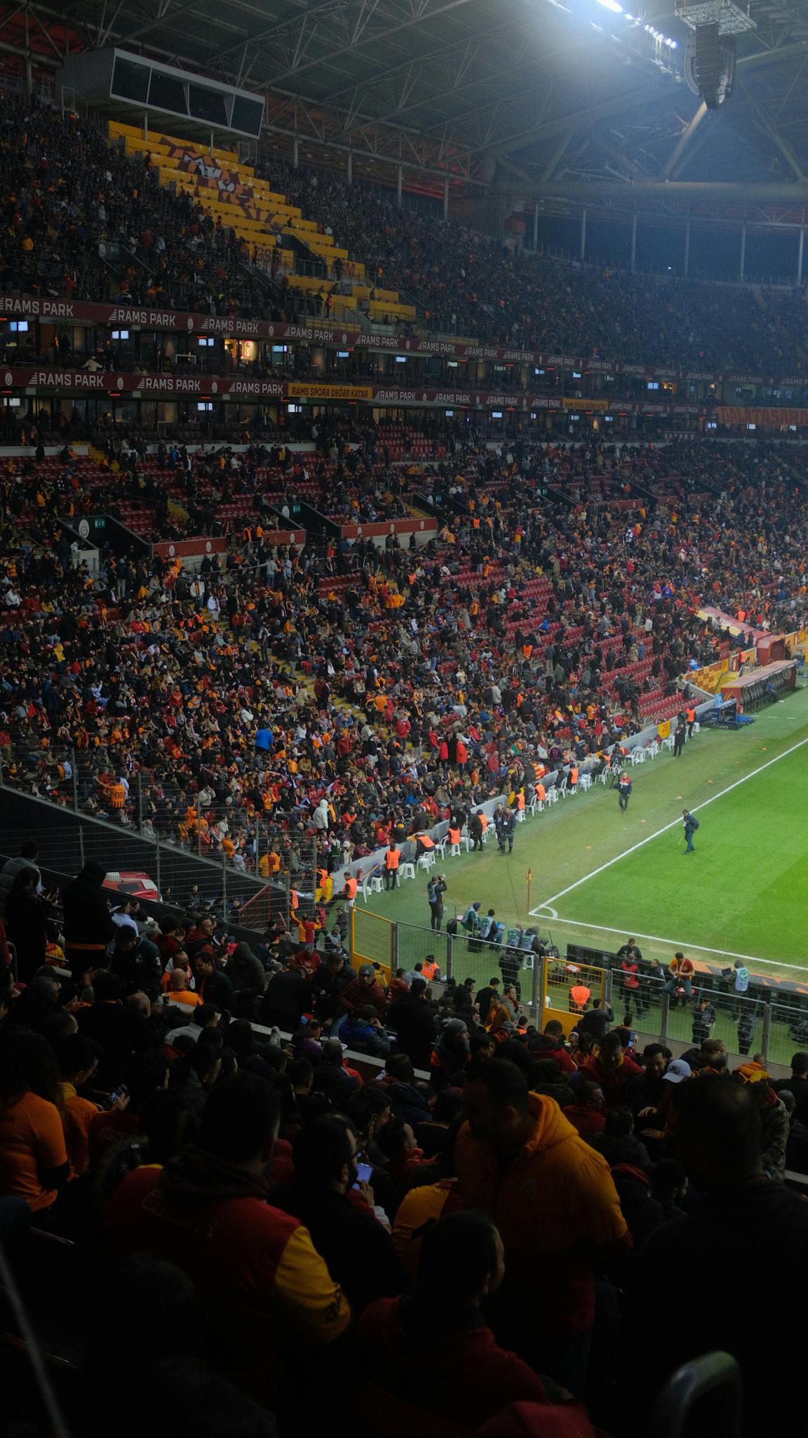 Energetic crowd watches a thrilling soccer match at Galatasaray Stadium in Istanbul, Turkey.